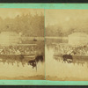 View of a group in small sidewheel boat on an unidentified lake.