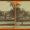 View of Boston Common showing fountain, trees, and lamps.