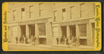Foster, Weeks & Co. grocery, showing men with boxes out front.