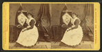 Caroline S. Brooks and her sculpture in butter during a public exhibition at Armory Hall in 1877.