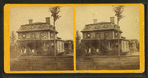 Johnson house showing the family on the porch of the wood frame home.