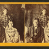 Portrait of two young women and one young man, animal skin used as backdrop.