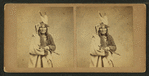 Studio portrait of Chippewas chief, O-gee-tub (Heavy sitter), holding a pipe.