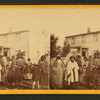 View of a group of Indians with Europeans in the yard of "Col. Murphy's near Shakopee".