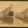 House with man on large woodpile.]