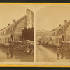 House with man on large woodpile.