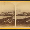 View of the town of Mackinac Island including general view showing piers.]