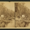 Boats and canoes landing at Camp Winedougdu(?) on the Brule River.]