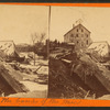 View of a house that has slid off the bank of the Mississippi.