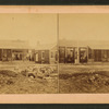 Men standing at the storefront.