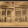 Group of men posing in front of a building, Pawnee City, Nebraska.