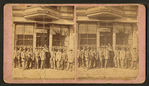 Group of men posing in front of a building, Pawnee City, Nebraska.