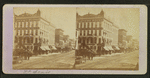 View of a clothing house and other stores in the commercial area in St. Louis.
