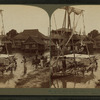 Quaint, straw-thatched houses of a Moro village, Philippine section of the World's Fair.