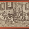 View of a group posing in front of a home.
