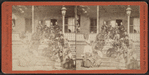 Group of women sitting on the porch and stairs.