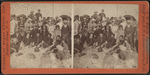 roup of men and women at the beach.