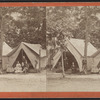 View of campers in front their tents.