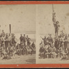 Group of men posing on a sailboat.