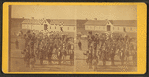 Taken at Fort Wingate, Dec. 11, 1871 [a group of native Americans and Burros in front of a building.]