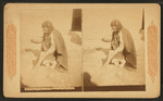 A Pueblo woman sweeping her floor.