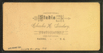 View of a man and woman standing in a street corner, Nashua.