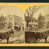 View of homes, and horse-drawn carts.
