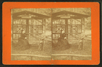 View of a woman and a boy, sitting on covered bench called 'Flora's Bower.'