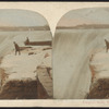 Niagara Falls, winter. [Figure peering over the ledge.]