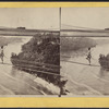 Man crossing over the river on a cable wire, Niagara Falls.