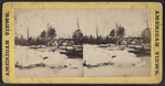 Snow and ice on river, with parts of machinery against shore.
