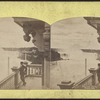 General view, Niagara Falls. [Man standing on balcony above falls.]