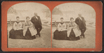 Tourists posing at Niagara Falls.