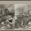 View of snow covered rocks and bridge.