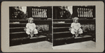 Child sitting on steps with doll.
