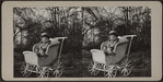 Child sitting in a carriage.