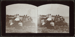 Group of men and women at the beach.