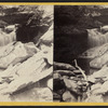 Cascade and overhanging Rocks.