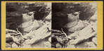 Cascade and overhanging Rocks.