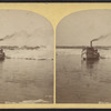Buffalo harbor, boat and ice in water.