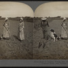 Beds of lettuce, young man with wheel hoe, girls with common hoes, near Buffalo, N.Y., U.S.A.