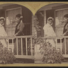 Portrait of two women standing on the porch.