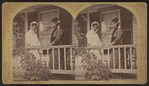 Portrait of two women standing on the porch.