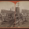 Erie Railroad yard showing locomotive, watertower.