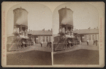 Erie Railroad yard showing locomotive and watertower.