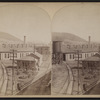 Erie Railroad yard showing round house, watertower and switching yard.