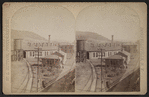 Erie Railroad yard showing round house, watertower and switching yard.
