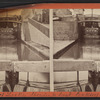View of locks, showing a boat locking through, Lockport, N.Y.