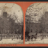 Horse and carriage on snowy street in front of large building, Lockport, N.Y.