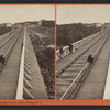 Looking across top of R.R. Bridge, Portage, N.Y., toward Depot.